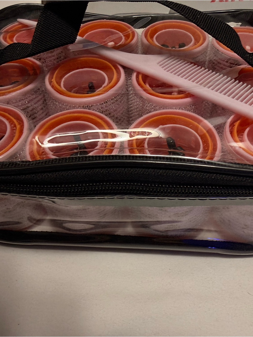 Clear Travel Pouch with Multi Sizes Pink and Orange Hair Rollers and clips
